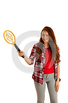 attractive Beautiful young woman holds electroc racket for kiling flys