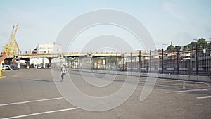 Attractive beautiful young woman riding roller skating in the streets. Urban background