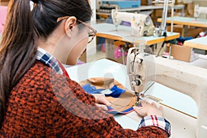 Attractive beauty female sewing employee