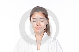 Attractive beauty young asian woman after washing face, cleaning her face on white background