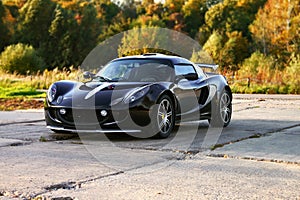 Attractive black sport car with big wheels.