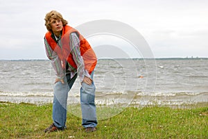 Attractive blond boy by the seaside