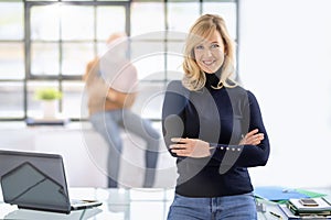 Attractive blond haired businesswoman portrait at the office