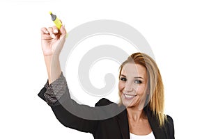 Attractive blond successful businesswoman holding marker writing on transparent board