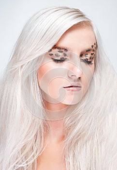 Attractive blond woman with leopard makeup