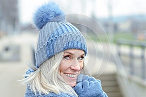 Attractive blond woman in warm winter fashion