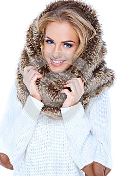Attractive blond woman wearing fur hood