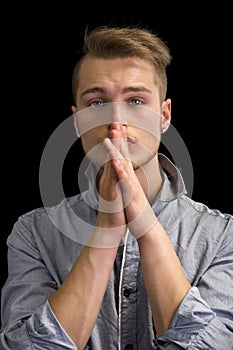 Attractive blond young man, serious expression