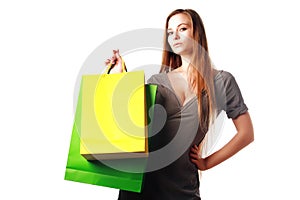 Attractive blonde girl with shopping bags isolated