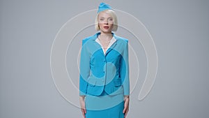 Attractive blonde stewardess holding safety instruction