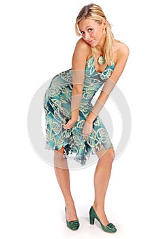 Attractive blonde woman in blue patterned dress