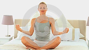 Attractive blonde woman doing yoga
