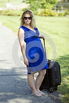 Attractive blonde woman with suitcase - disability