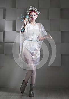 Attractive blonde woman touching the button in virtual interface