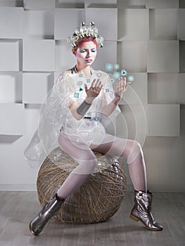 Attractive blonde woman touching the button in virtual interface