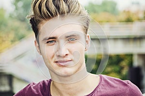 Attractive blue eyed, blond young man head-shot