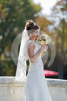 Attractive bride in park