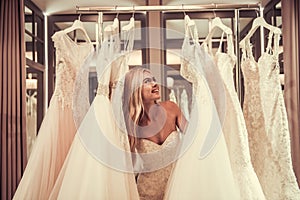 Attractive bride in wedding salon