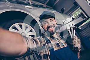 Attractive brunet bearded automotive expert with beaming smile m