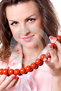 Attractive brunet woman with red beads