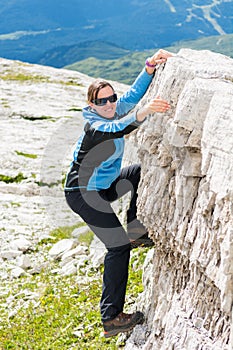 Attractive brunette rock climbing.