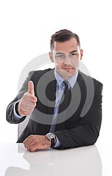 Attractive business man facing camera : thumb up isolated on white background