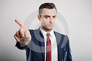 Attractive business man showing denial gesture
