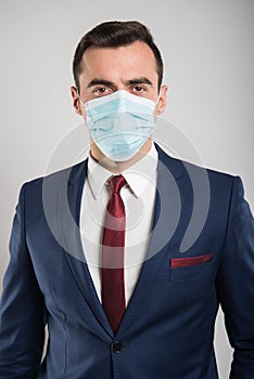 Attractive business man wearing face sterile mask