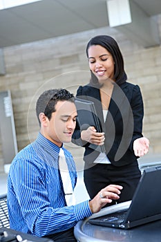 Attractive Business Team with Laptop