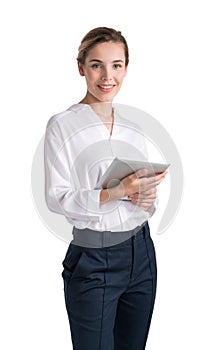 Attractive business woman in formal clothes is holding a tablet device and smiling toward camera. Full length businesswoman