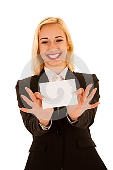 Attractive business woman hilding blank white banner isolated over white background photo