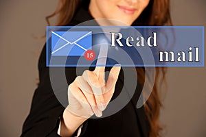 Attractive business woman pressing a virtual button read mail