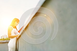 Attractive business woman reads  real file outside, concept moden women working in business