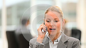 Attractive business woman speaking on the phone