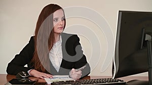 Attractive business woman work at her desk