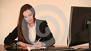 Attractive business woman work at her desk