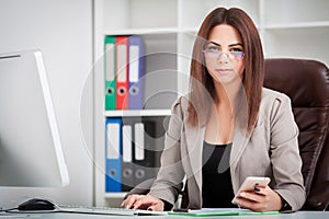 Attractive business woman working on laptop computer