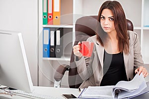 Attractive business woman working on laptop computer