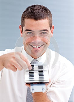 Attractive businessman consulting a directory