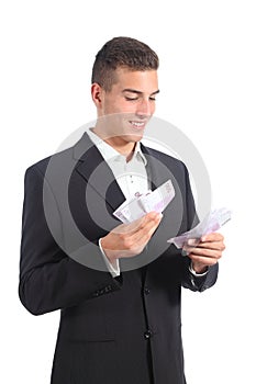 Attractive businessman counting money