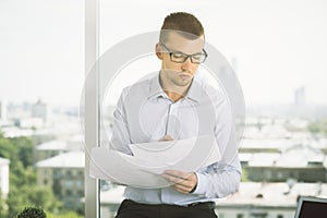 Attractive businessman doing paperwork