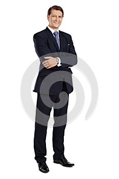 Attractive businessman standing with arms crossed