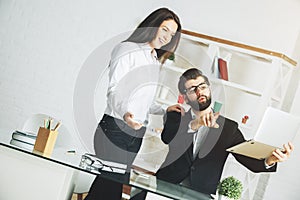 Attractive businessman and woman working on project