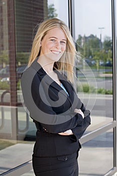 Attractive businesswoman with arms crossed