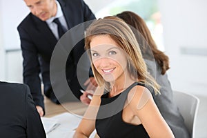 Attractive businesswoman attending meeting