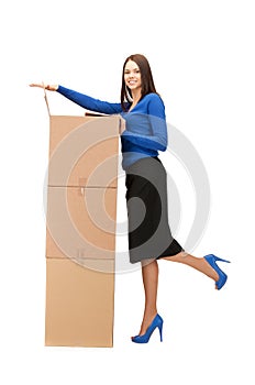 Attractive businesswoman with big boxes