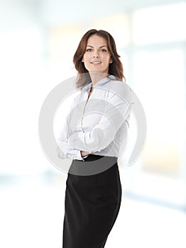 Attractive businesswoman with her arms crossed