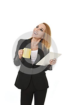 Attractive businesswoman holding digital tablet pad wearing business suit smiling happy looking thoughtfu