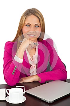 Attractive businesswoman holding a pen