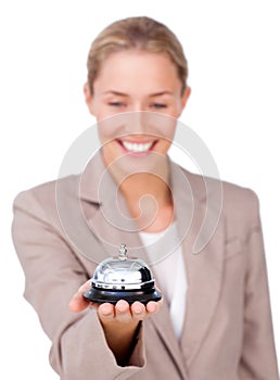 Attractive businesswoman holding a service bell